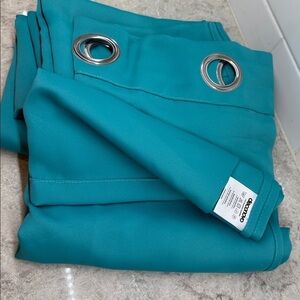 Teal Grommet Curtains 2 panels each 41x63in. Brand new polyester